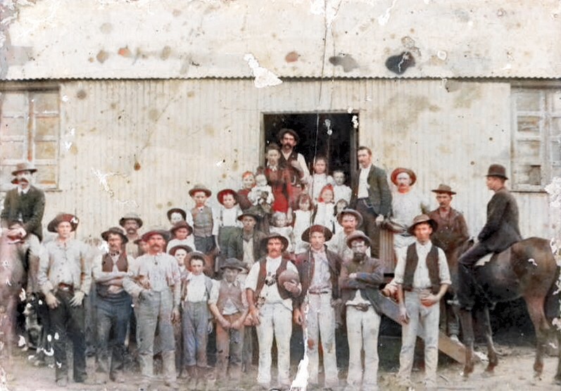 Group photograph of workers and families outside Burke's Store, Dunbible, during railway construction, circa 1890s Via Tweed Regional Museum